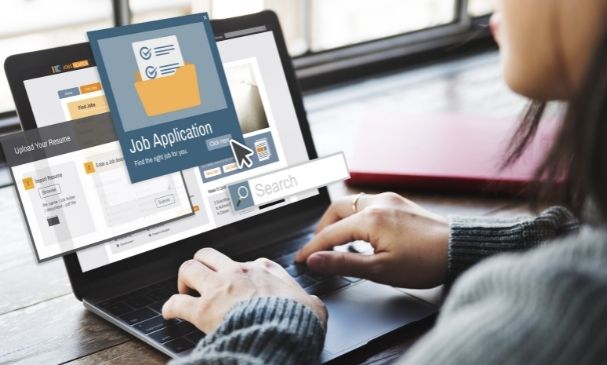 Person using laptop to navigate job application process, featuring "Job Application" interface and search functionality, relevant to Texas DUI job application strategies.