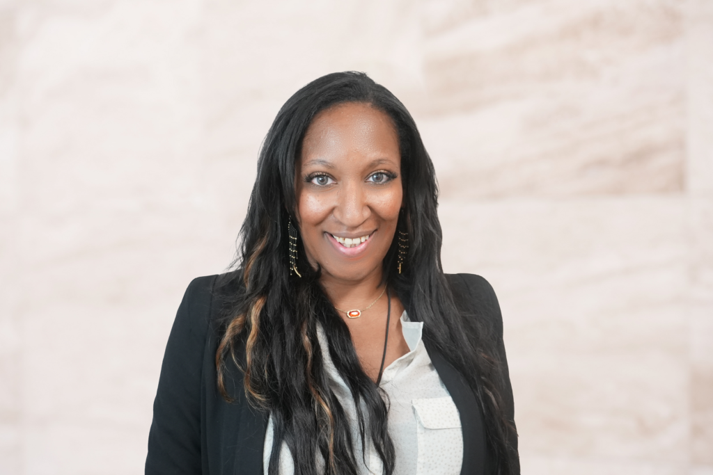 Raven Brown, Texas DUI and criminal defense attorney, smiling in professional attire, with a soft-focus background.