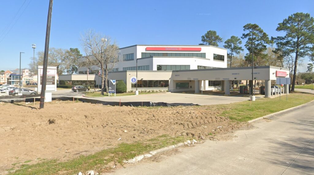 Bank of America building in Atascocita, Texas, near FM 1960 and Atascocita Shores Drive, with visible signage and parking area, serving as a landmark for the Bryan Fagan Law Office.